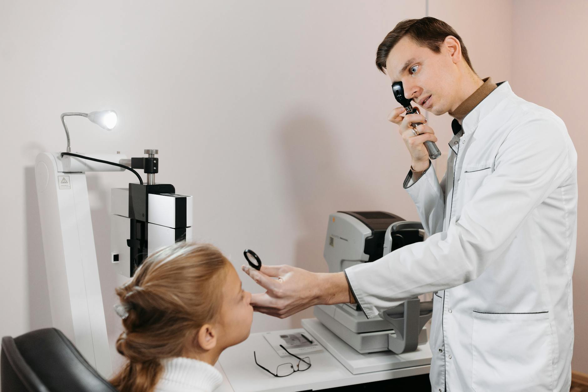 an ophthalmologist conducting a vision test